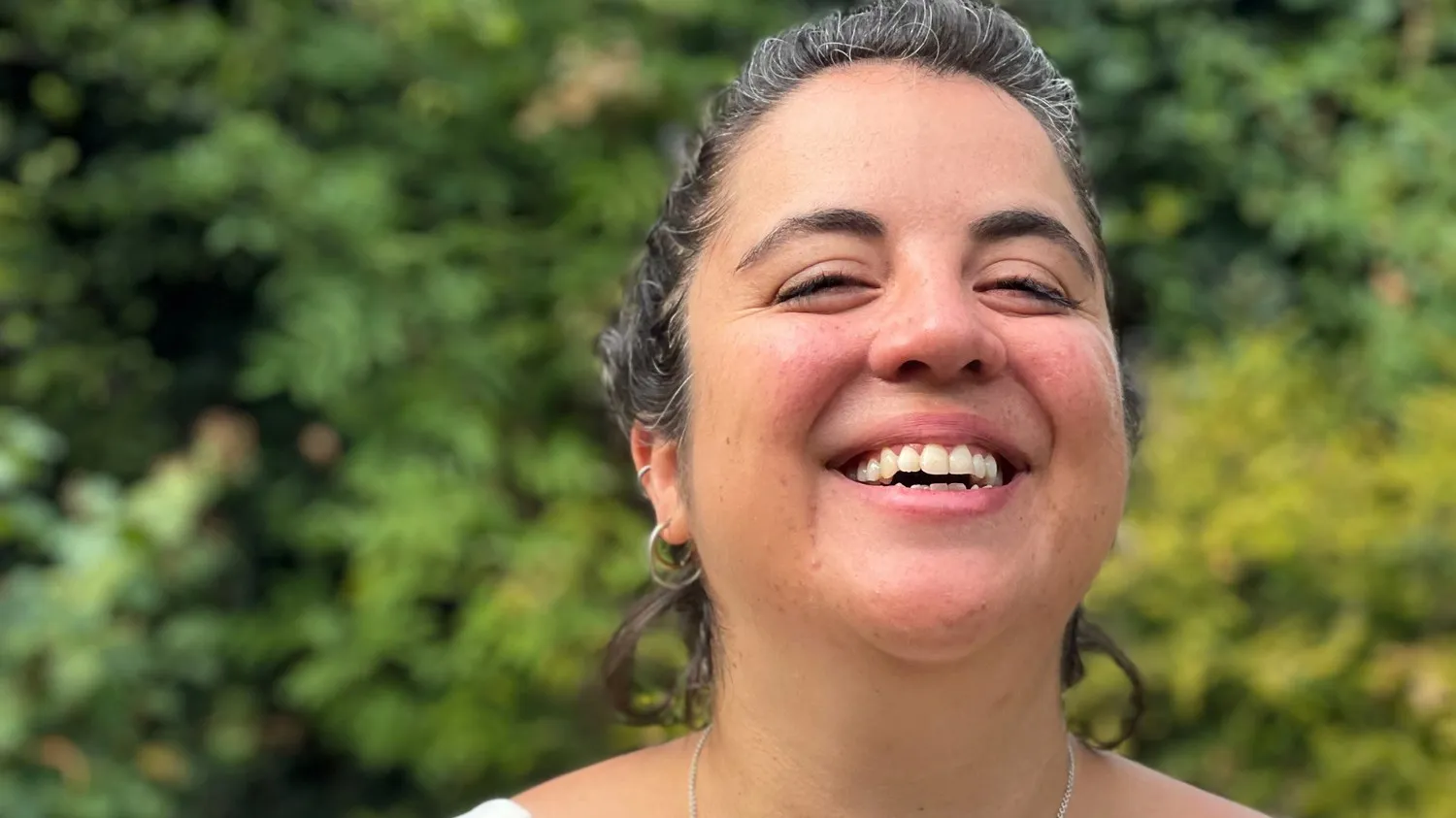 Maria smiling outdoors