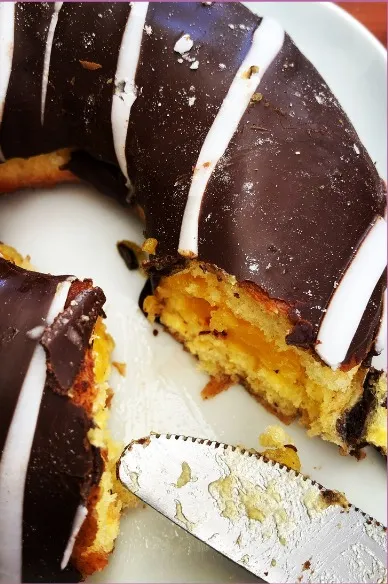Food photograph — chocolate-dipped pastry