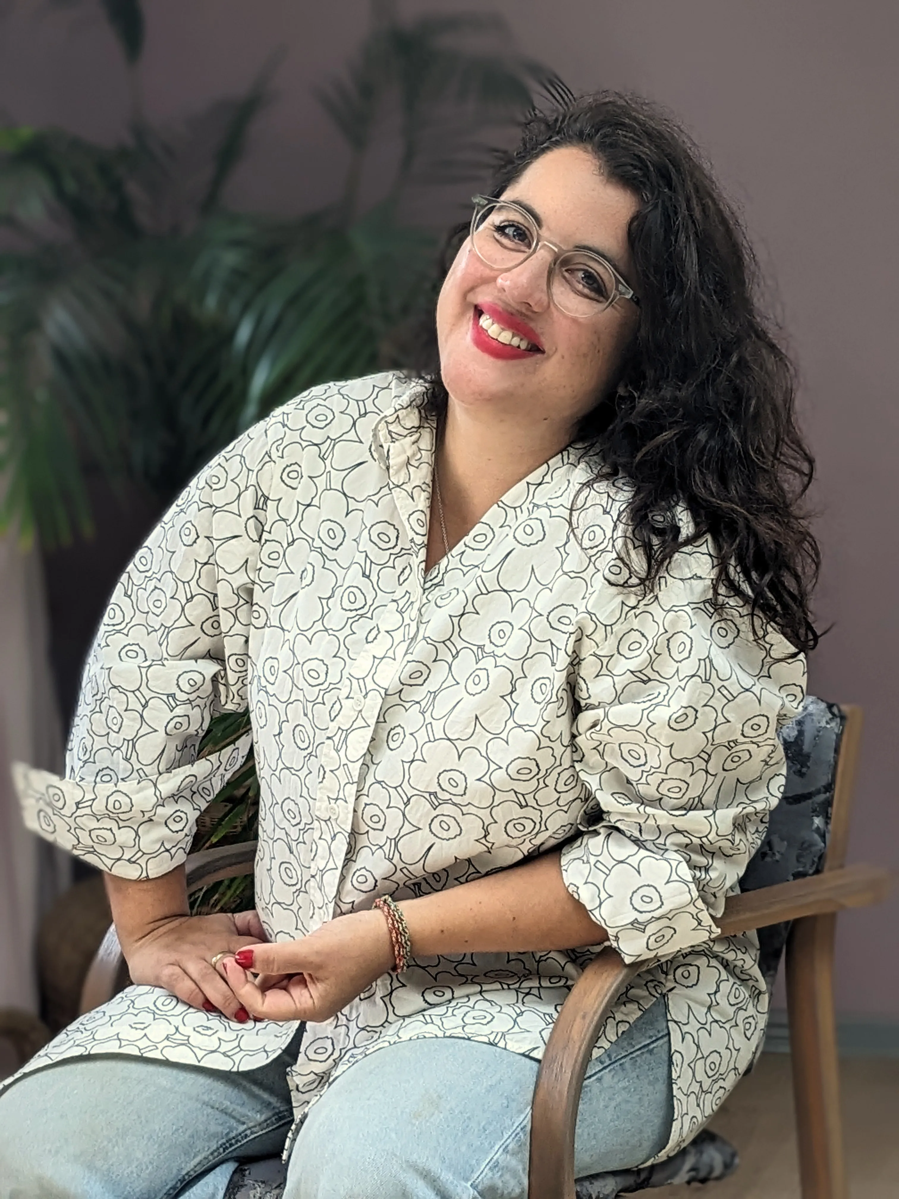 Maria Montserrat smiling, seated, warm and grounded
